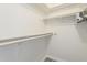 Well-organized walk-in closet offering ample storage with shelving and hanging rods at 4554 E Paradise Village N Pkwy # 249, Phoenix, AZ 85032