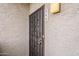 Close-up of the front door, showing the security gate and unit number, ensuring privacy and safety at 4554 E Paradise Village N Pkwy # 249, Phoenix, AZ 85032