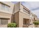 Exterior building showcasing multiple units, a balcony, and surrounding landscaping, perfect for outdoor living at 4554 E Paradise Village N Pkwy # 249, Phoenix, AZ 85032