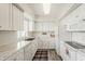 Bright, all-white kitchen with updated appliances and countertops, offering a clean and modern cooking space at 4554 E Paradise Village N Pkwy # 249, Phoenix, AZ 85032