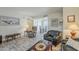 Open-concept living room with contemporary décor and stylish furniture, seamlessly connected to the dining area at 4554 E Paradise Village N Pkwy # 249, Phoenix, AZ 85032