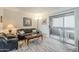 Relaxing living room with a sliding door leading to the balcony, offering ample natural light and fresh air at 4554 E Paradise Village N Pkwy # 249, Phoenix, AZ 85032