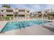Resort-style pool with lounge chairs offer a relaxing oasis for residents of this inviting condo complex at 4554 E Paradise Village N Pkwy # 249, Phoenix, AZ 85032