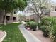 Inviting walkway amidst lush landscaping in a well-maintained community at 4554 E Paradise Village N Pkwy # 249, Phoenix, AZ 85032
