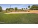 Community basketball court and grassy field provide open space for recreational activities at 4643 N Clear Creek Dr, Litchfield Park, AZ 85340