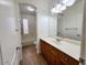 Bright bathroom showcasing tile floors, wood cabinets, and shower/tub combo at 4643 N Clear Creek Dr, Litchfield Park, AZ 85340