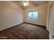 Bright bedroom featuring neutral walls, carpet floors, ceiling fan, and natural light at 4643 N Clear Creek Dr, Litchfield Park, AZ 85340