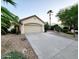 Exterior shot of two-car garage with a desert-style landscaped front yard at 4643 N Clear Creek Dr, Litchfield Park, AZ 85340