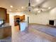 Spacious open concept kitchen flows into the living room with stone countertops at 4643 N Clear Creek Dr, Litchfield Park, AZ 85340