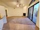 Open floor plan with tile flooring leading to a carpeted living room and patio access at 4643 N Clear Creek Dr, Litchfield Park, AZ 85340