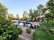 Community water feature with surrounding desert landscaping and lush trees at 4643 N Clear Creek Dr, Litchfield Park, AZ 85340