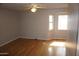 Spacious bedroom features wood floors, ceiling fan and bay window offering natural light at 4773 E Hopi St, Phoenix, AZ 85044