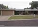 Traditional single-story home featuring a two-car garage and well-maintained landscaping at 4773 E Hopi St, Phoenix, AZ 85044