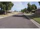 A quiet residential street lined with mature trees and well-kept lawns at 4773 E Hopi St, Phoenix, AZ 85044
