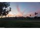 Scenic sunset view over a golf course with mountains in the distance, creating a serene atmosphere at 4773 E Hopi St, Phoenix, AZ 85044