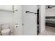 Hallway bathroom with toilet and towel rack, plus closet access at 5361 N 77Th Ln, Glendale, AZ 85303