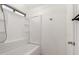 Clean bathroom featuring a white shower-tub combination and tile floors at 5361 N 77Th Ln, Glendale, AZ 85303