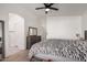 Cozy bedroom with a ceiling fan, dresser, and neutral color palette at 5361 N 77Th Ln, Glendale, AZ 85303