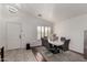 An elegant dining room with modern table, chandelier and natural light at 5361 N 77Th Ln, Glendale, AZ 85303