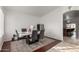 Dining room featuring a modern table and decor, and open to the kitchen at 5361 N 77Th Ln, Glendale, AZ 85303