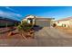 Charming single-story home showcasing a well-kept front yard and two car garage at 5361 N 77Th Ln, Glendale, AZ 85303