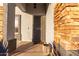 Inviting entryway showcasing a security screen door and tasteful outdoor decor at 5361 N 77Th Ln, Glendale, AZ 85303