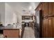 Modern kitchen with an oversized granite island, stainless steel appliances, and custom wood cabinetry at 5361 N 77Th Ln, Glendale, AZ 85303