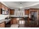 Well-appointed kitchen featuring granite countertops, stainless steel appliances, and custom cabinetry at 5361 N 77Th Ln, Glendale, AZ 85303