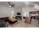 Open floor plan connecting living room and kitchen, with modern finishes and ample natural light at 5361 N 77Th Ln, Glendale, AZ 85303