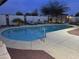 Backyard oasis with a stunning pool, elegant lounge chairs, a charming pergola, and lush landscaping at 5361 N 77Th Ln, Glendale, AZ 85303