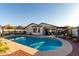 Inviting backyard oasis featuring a sparkling pool, covered patio, and well-maintained landscaping for outdoor enjoyment at 5361 N 77Th Ln, Glendale, AZ 85303