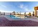 Inviting backyard pool area with comfortable lounge chairs and beautiful palm trees at 5361 N 77Th Ln, Glendale, AZ 85303