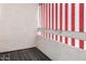 Balcony with red and white striped privacy screens at 5741 N 44Th Ln, Glendale, AZ 85301