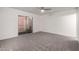 Bedroom featuring carpet flooring, a ceiling fan, and private balcony access at 5741 N 44Th Ln, Glendale, AZ 85301