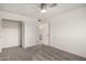 This bedroom includes neutral carpet, a closet and a door to the en-suite bathroom at 5741 N 44Th Ln, Glendale, AZ 85301
