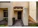 Close-up of a townhome entrance with a tile porch roof and desert landscaping at 5741 N 44Th Ln, Glendale, AZ 85301