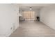 Open-concept living room featuring light tile floors and sliding glass doors at 5741 N 44Th Ln, Glendale, AZ 85301