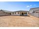 The backyard has a covered patio, a block wall, and is ready for your personalized landscaping at 5875 N 193Rd Dr, Litchfield Park, AZ 85340