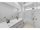 Bright bathroom featuring double sinks, white cabinets, and a separate shower and tub at 5875 N 193Rd Dr, Litchfield Park, AZ 85340