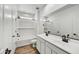 The bathroom features double sinks, white subway tiles in the shower, and wood-look floors at 5875 N 193Rd Dr, Litchfield Park, AZ 85340
