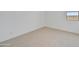 Comfortable bedroom with neutral carpet, white trim, and ample natural light at 5875 N 193Rd Dr, Litchfield Park, AZ 85340