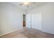 Bedroom showcasing neutral carpet, white walls, ceiling fan and closet at 6615 S 25Th Dr, Phoenix, AZ 85041