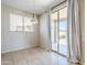 Bright dining area with tile flooring, modern pendant light, and access to the backyard patio at 6615 S 25Th Dr, Phoenix, AZ 85041