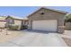 Charming home with a two-car garage, neutral paint and desert landscaping at 6615 S 25Th Dr, Phoenix, AZ 85041