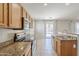Beautiful kitchen featuring stainless steel appliances, granite countertops, and access to backyard at 6615 S 25Th Dr, Phoenix, AZ 85041