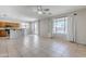 Spacious living area with lots of light, tile flooring, and an open floor plan that connects to the kitchen at 6615 S 25Th Dr, Phoenix, AZ 85041