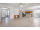 Open-concept living area with tile floors, great natural light, and seamless transition into the kitchen at 6615 S 25Th Dr, Phoenix, AZ 85041