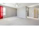 Large main bedroom features neutral walls, carpet and access to ensuite bath at 6615 S 25Th Dr, Phoenix, AZ 85041