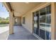 Covered patio showcasing sliding glass doors and a serene view of the backyard at 6615 S 25Th Dr, Phoenix, AZ 85041