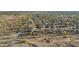 Panoramic aerial view of a residential neighborhood surrounded by desert landscape at 7628 W Donald Dr, Peoria, AZ 85383
